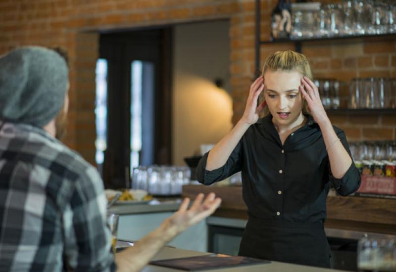 stressed employee with aggressive customer