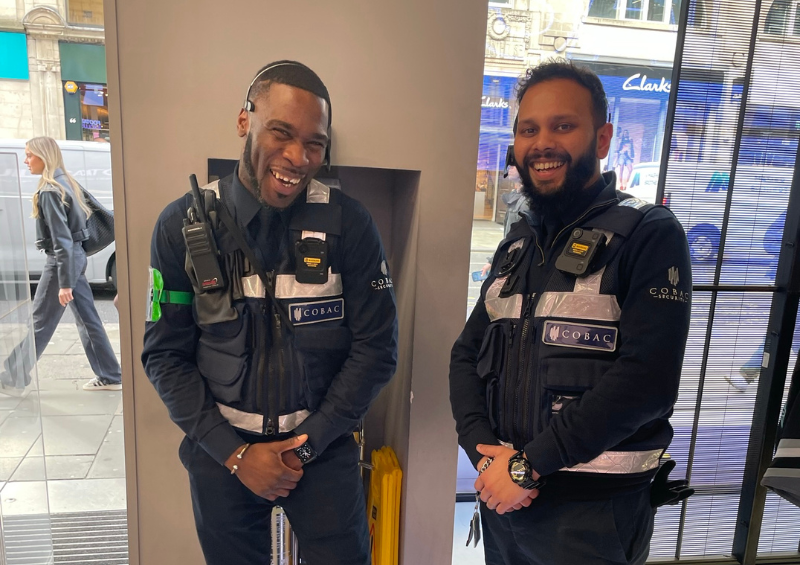 Two Cobac Security retail officers smiling during a shift